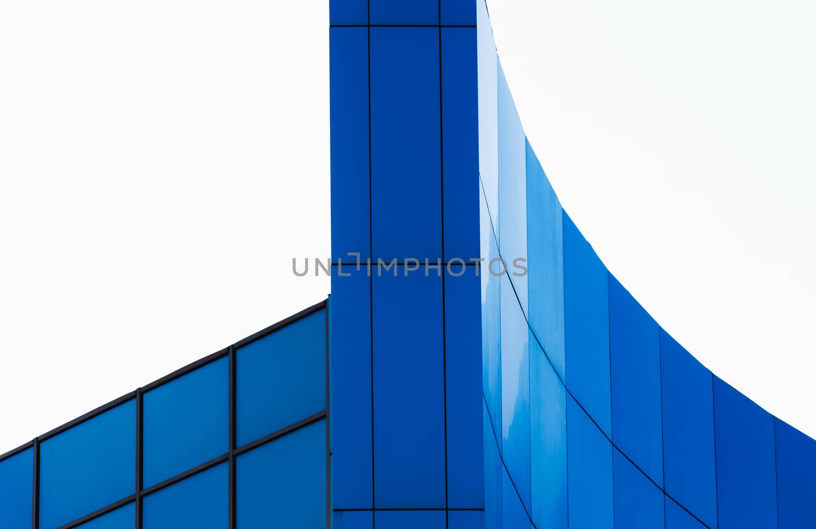 architectural abstract pattern fragment of a wall of blue modern building on a white background