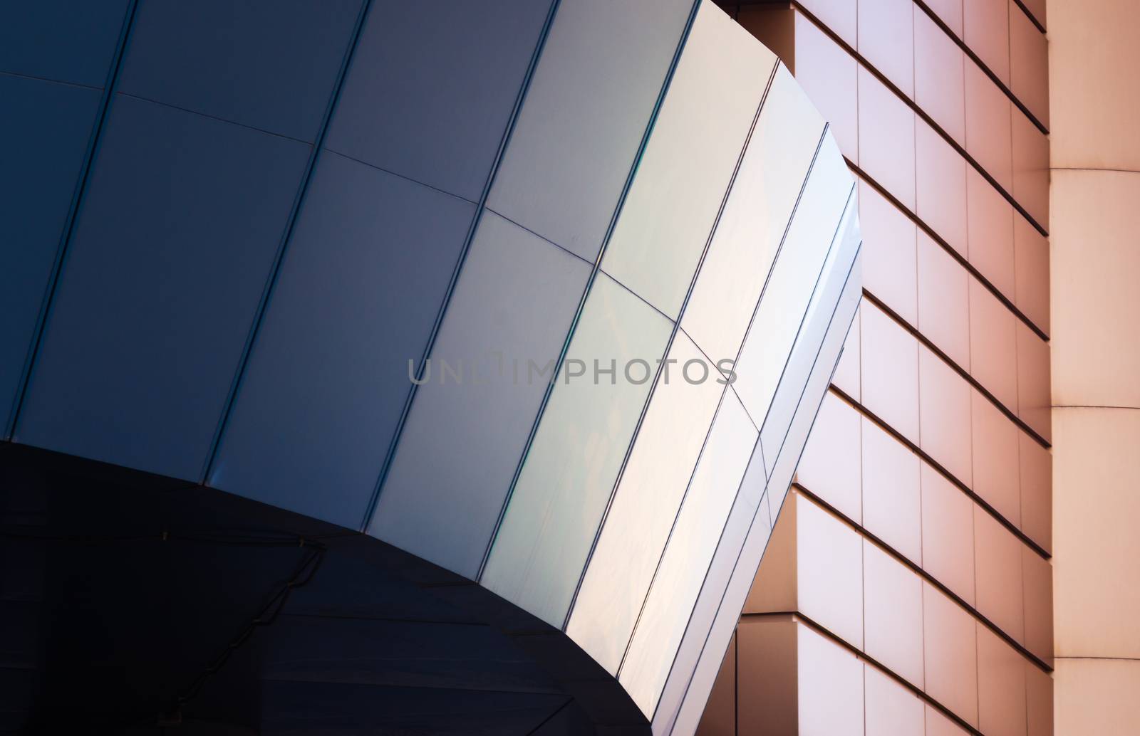 architectural abstract pattern fragment of a wall of blue modern building on a white background