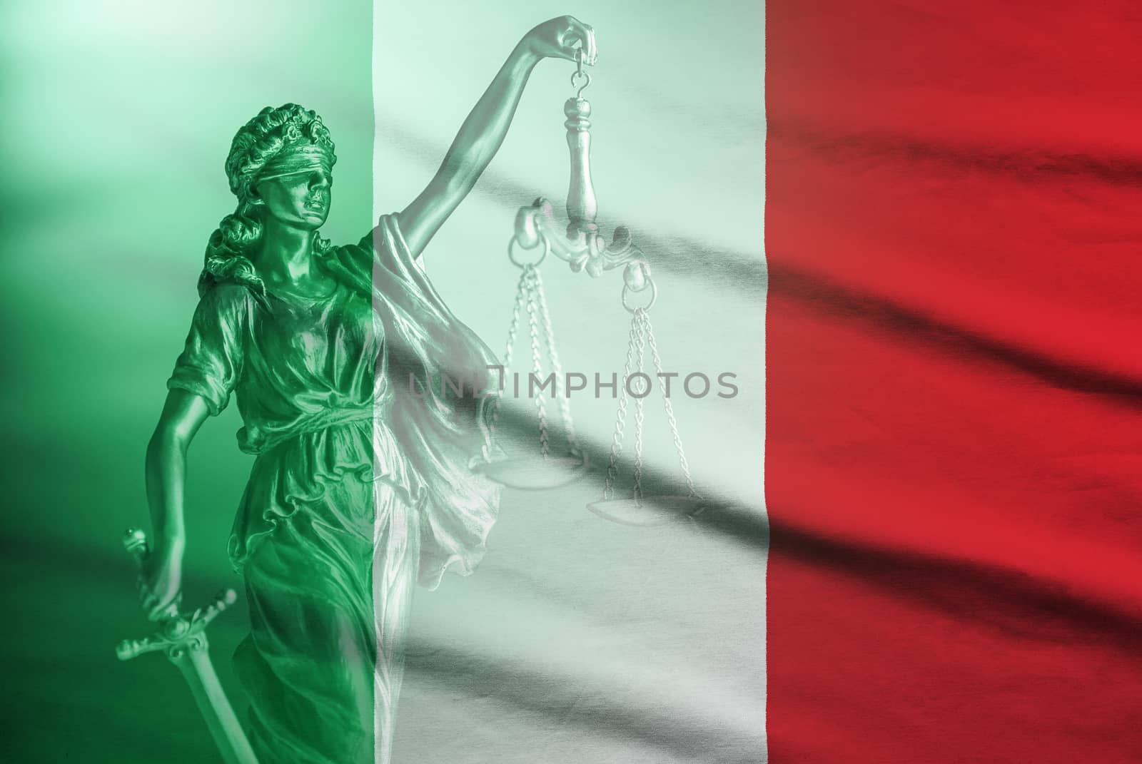 National flag of Italy with statue of Justice holding the scales and sword of law enforcement in a full frame view with copy space