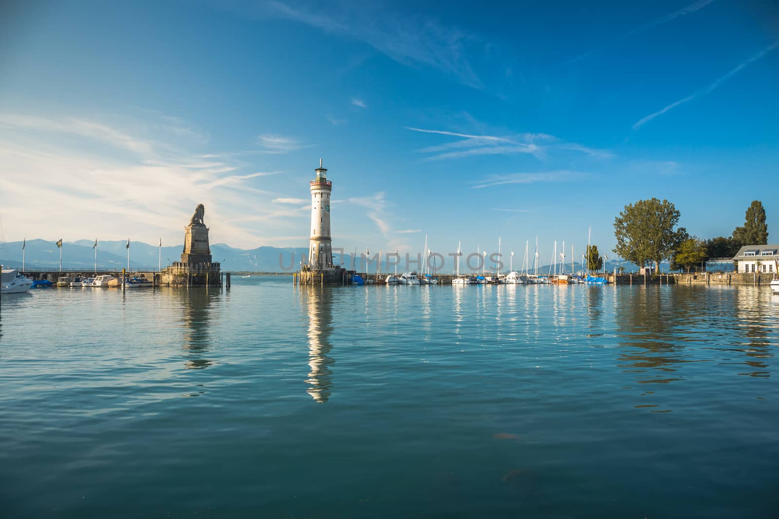 Harbour entrance of Lindau, Lake Constance - Bodensee - with the new lighthouse and the Bavarian Lion. The Lindau lighthouse is the southernmost lighthouse in Germany, in Lindau on Lake Constance