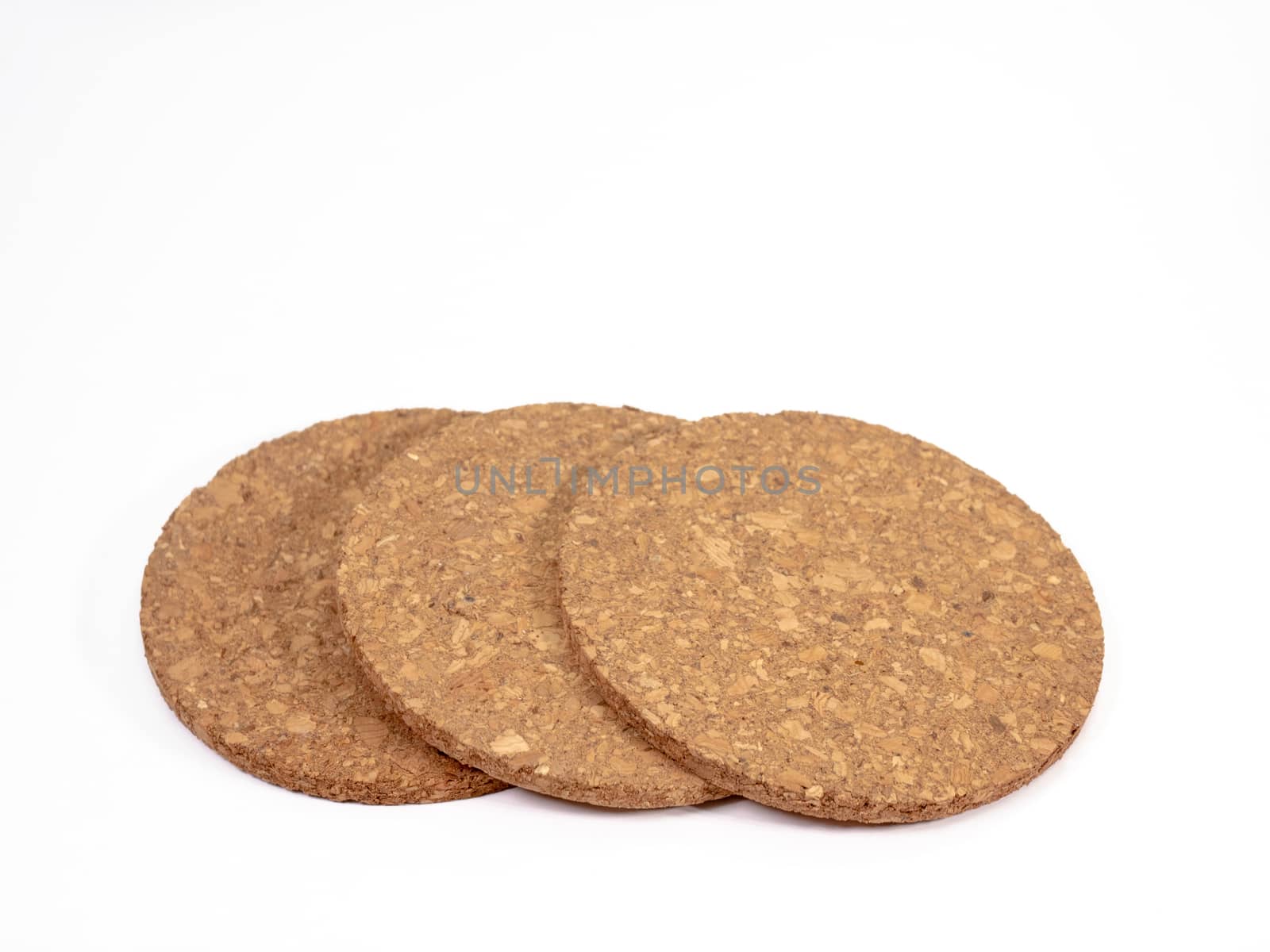 The close up of wooden cork coasters on white background.
