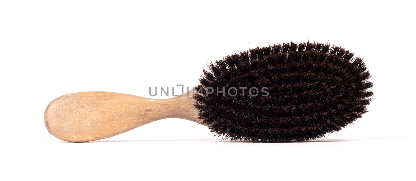 Old hair brush with some hair in it by michaklootwijk