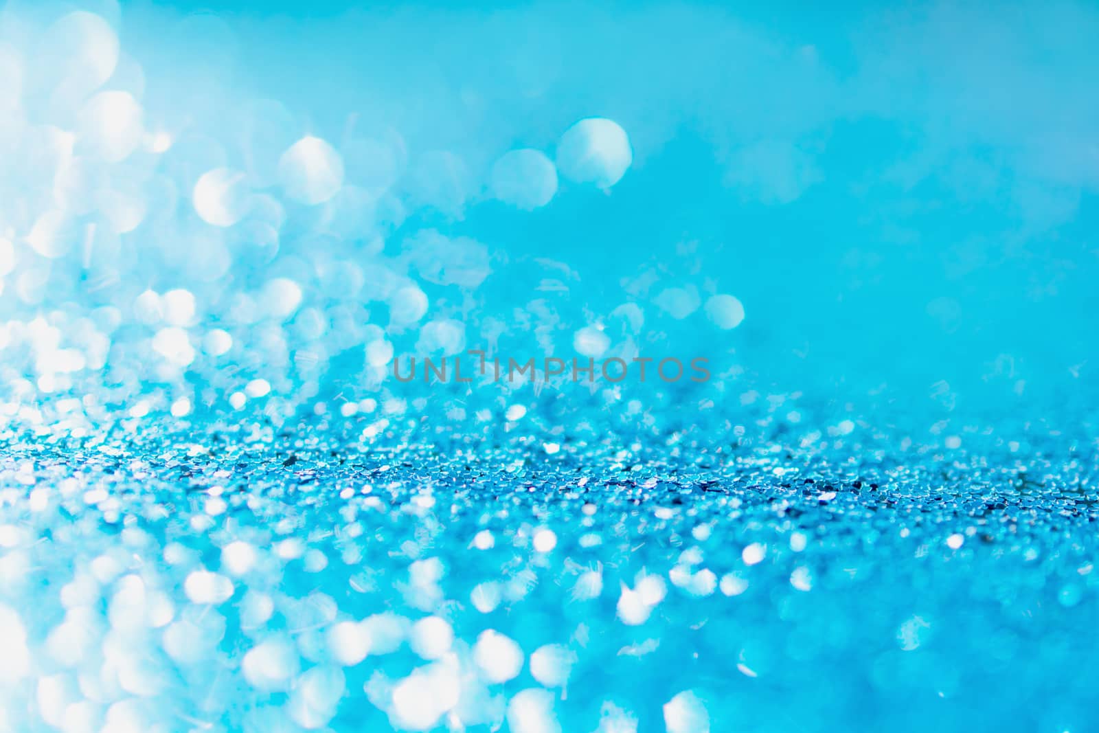 Defocused blue glitter background. blue abstract bokeh background. Christmas abstract background
