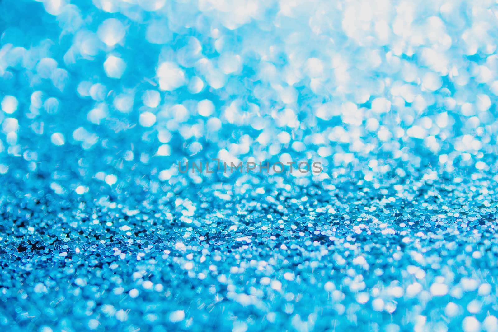 Defocused blue glitter background. blue abstract bokeh background. Christmas abstract background
