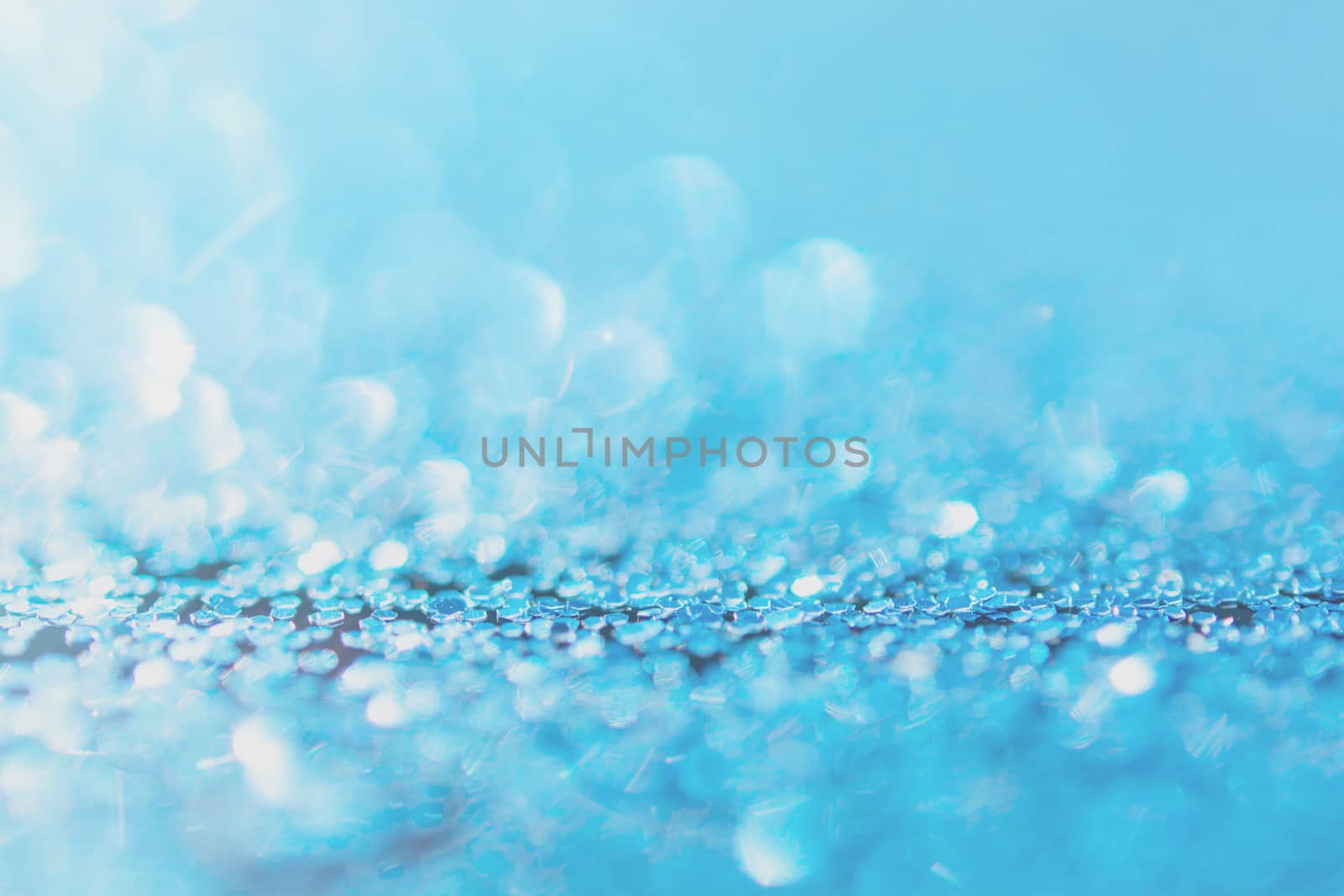 Defocused blue glitter background. blue abstract bokeh background. Christmas abstract background
