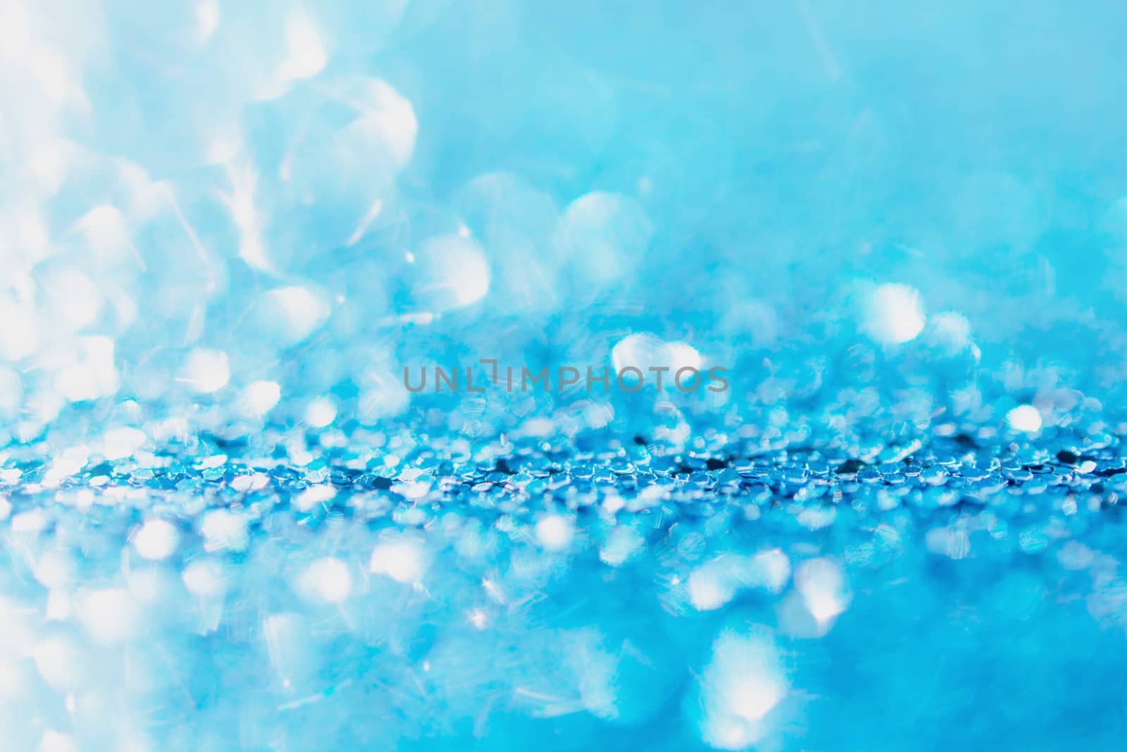 Defocused blue glitter background. blue abstract bokeh background. Christmas abstract background
