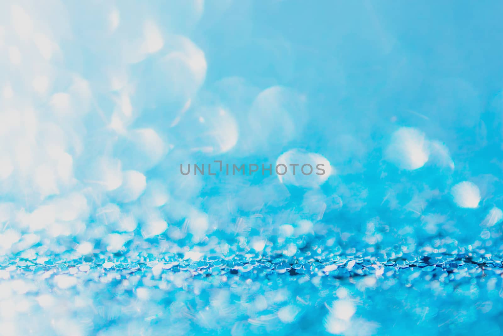 Defocused blue glitter background. blue abstract bokeh background. Christmas abstract background
