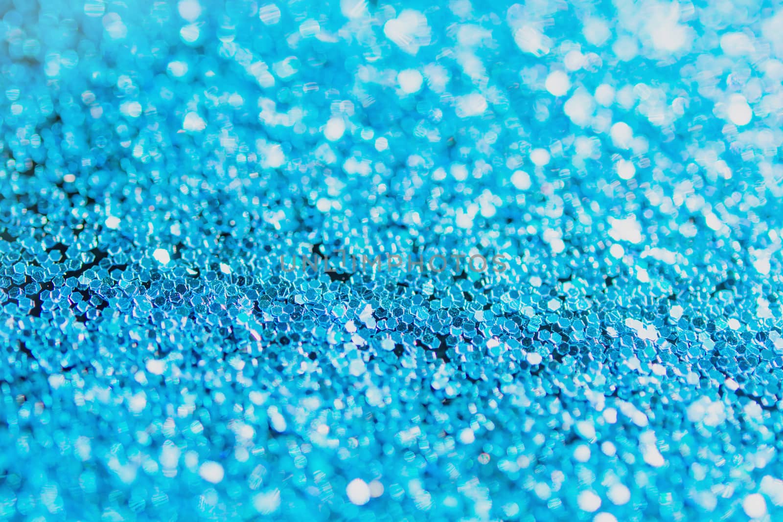 Defocused blue glitter background. blue abstract bokeh background. Christmas abstract background
