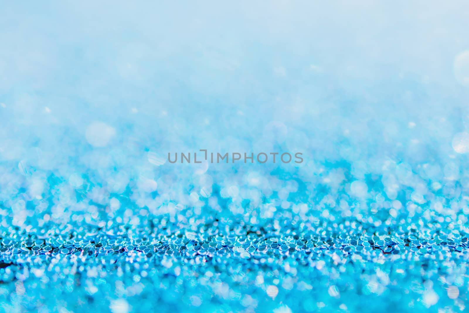 Defocused blue glitter background. blue abstract bokeh background. Christmas abstract background
