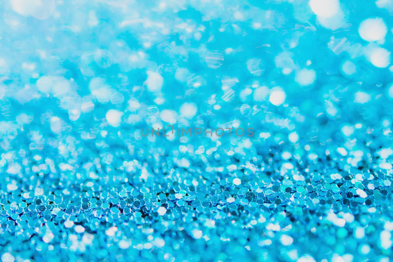 Defocused blue glitter background. blue abstract bokeh background. Christmas abstract background

