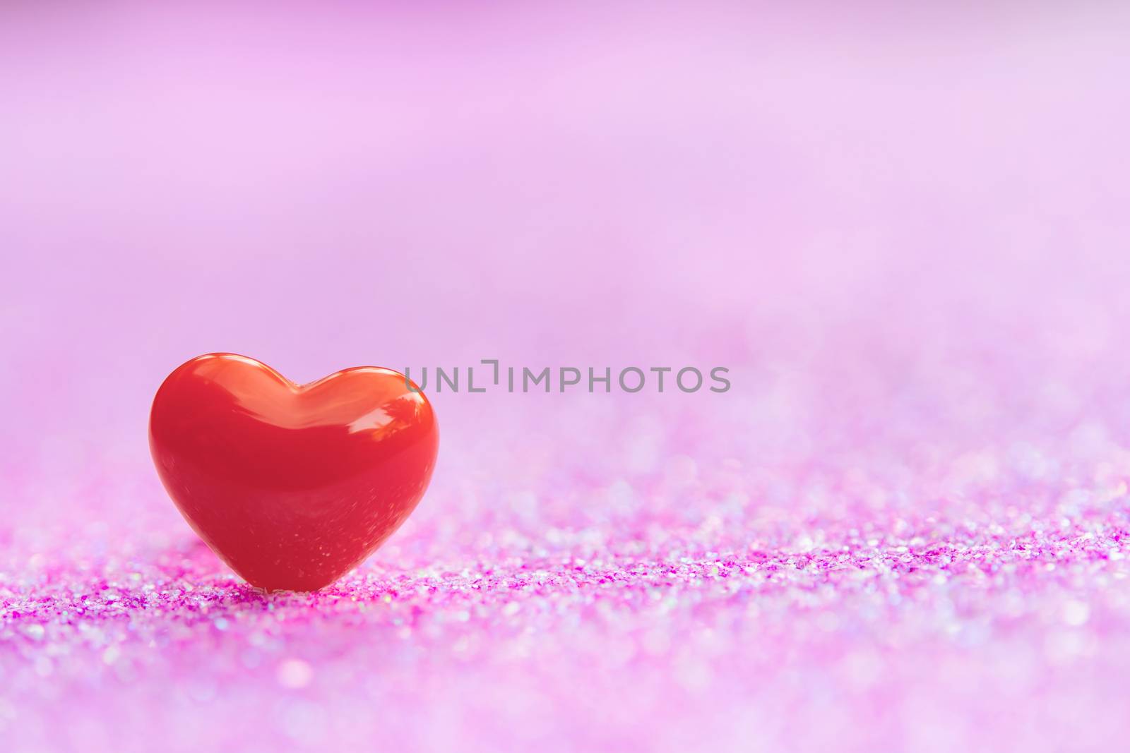 Valentines Day background with Red heart shapes on abstract light pink glitter background, Copy space