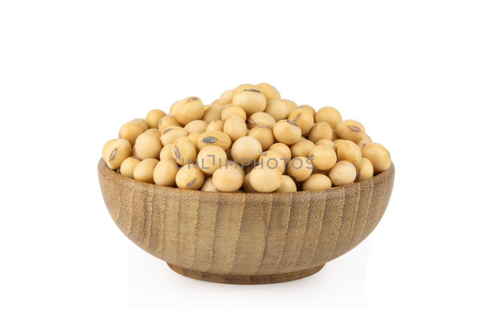 Soy beans in bowl wood isolated on white background with clipping path

