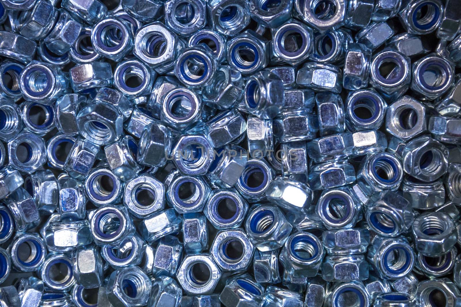 A pile of galvanized industrial nuts.