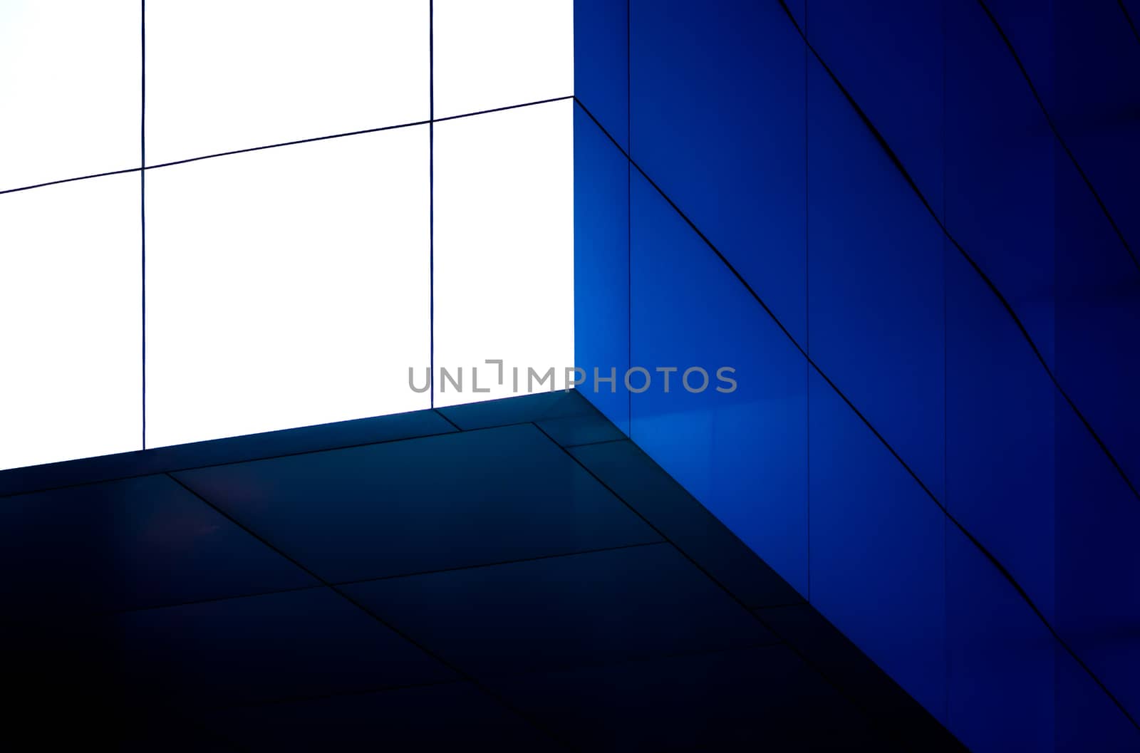 architectural abstract pattern fragment of a wall of blue modern building on a white background