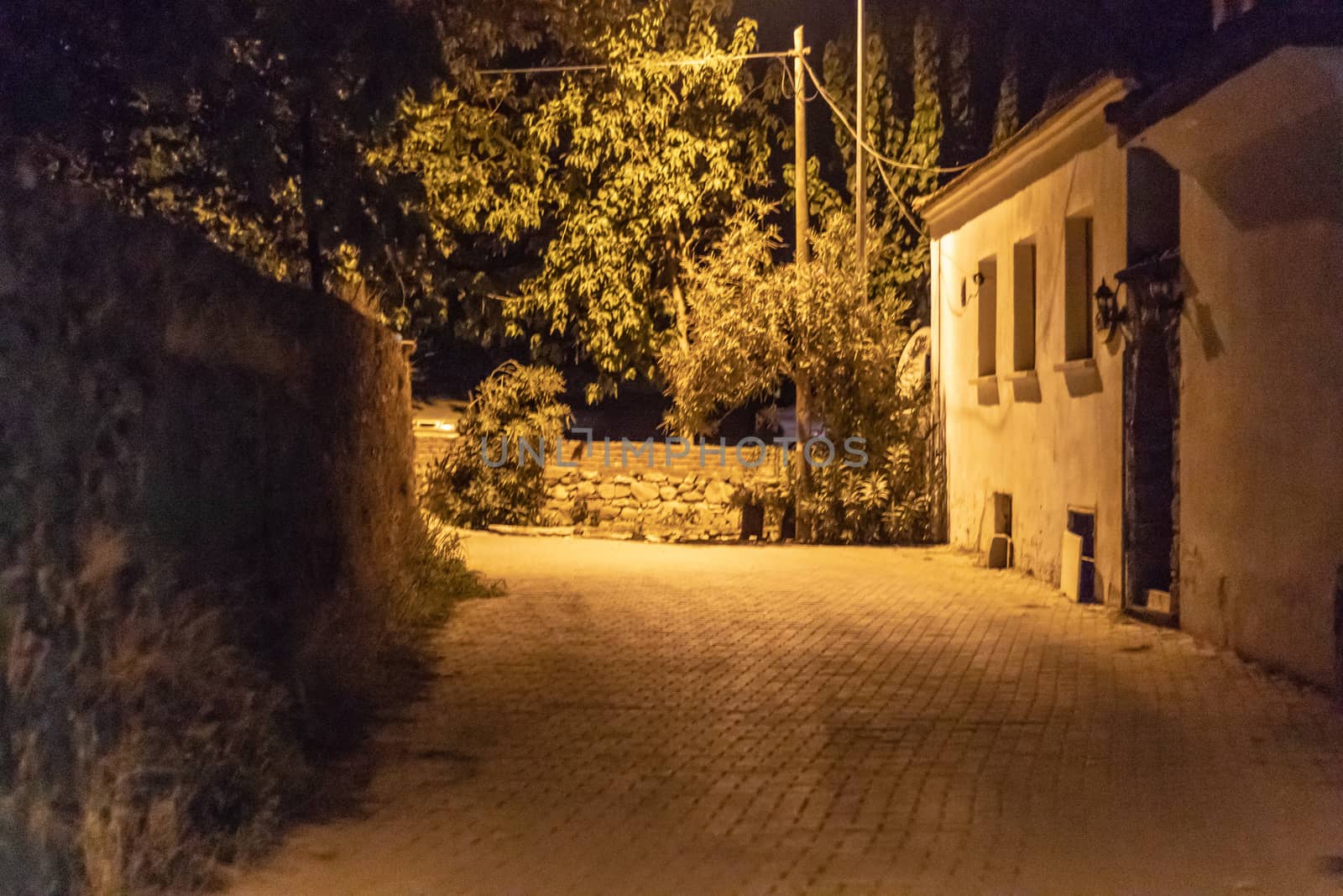 a very well composed night shoot from an urban street - there is street light at village. photo has taken izmir/turkey.