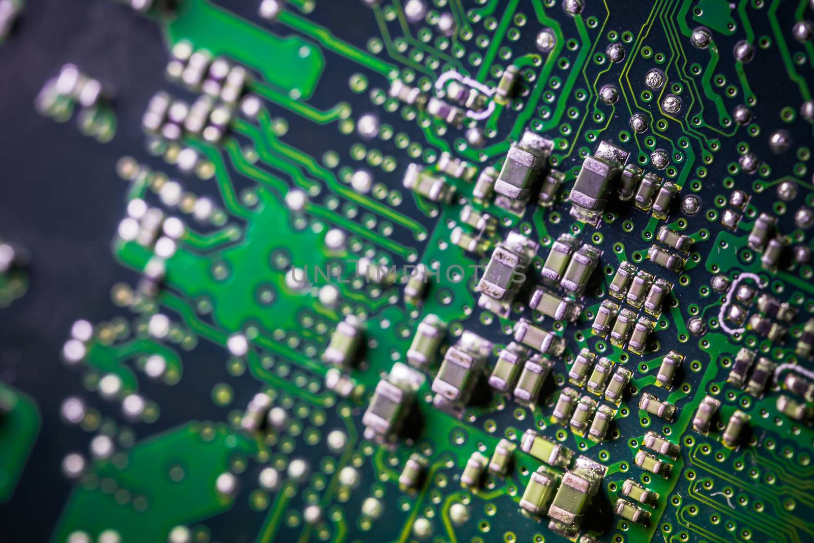 Circuit board. Electronic computer hardware technology. Motherboard digital chip. Tech science background. Integrated communication processor. SMD resistors and capacotors. Green PCB. by petrsvoboda91
