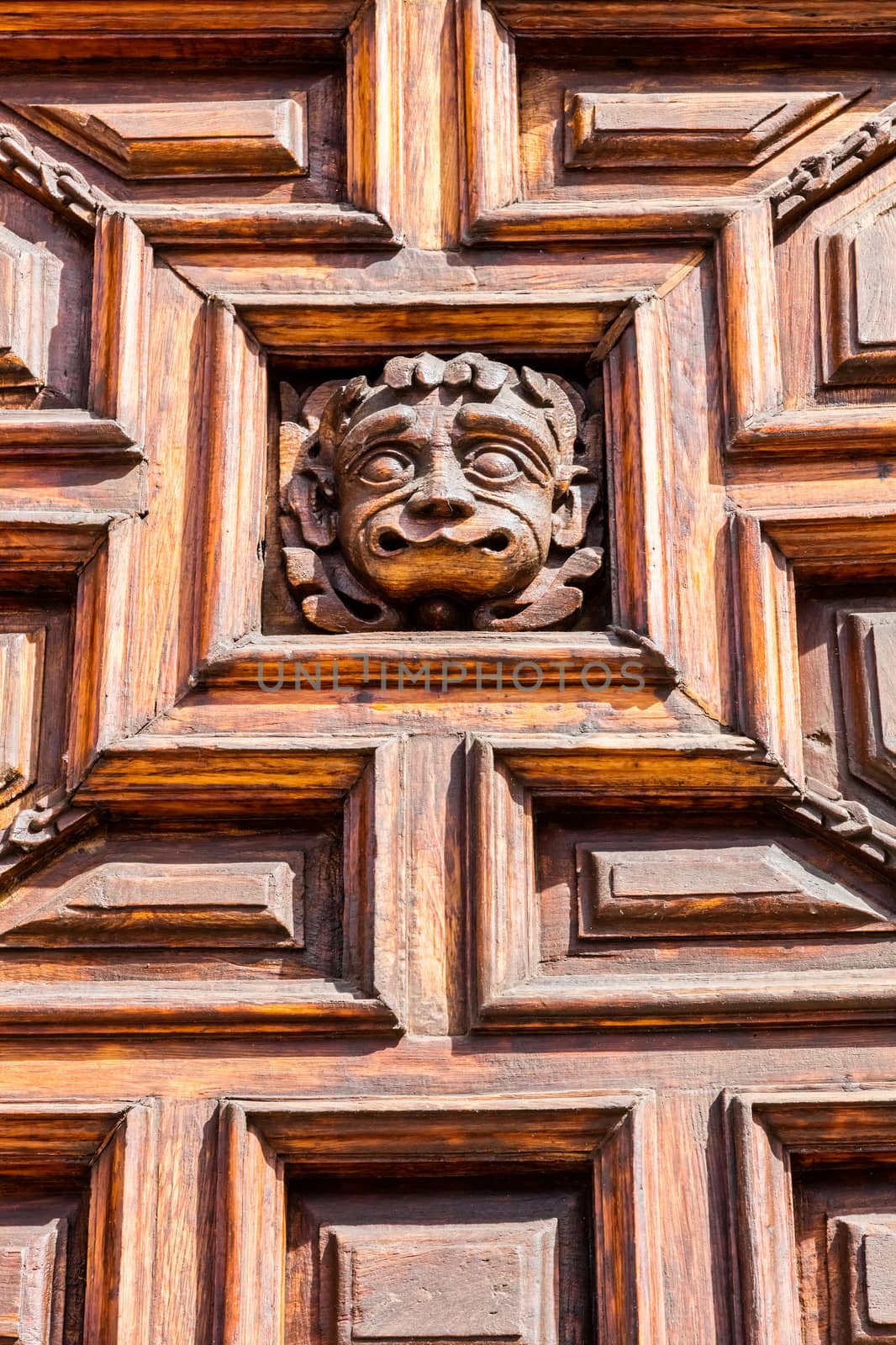 Old wood sculpture with the woodworm holes