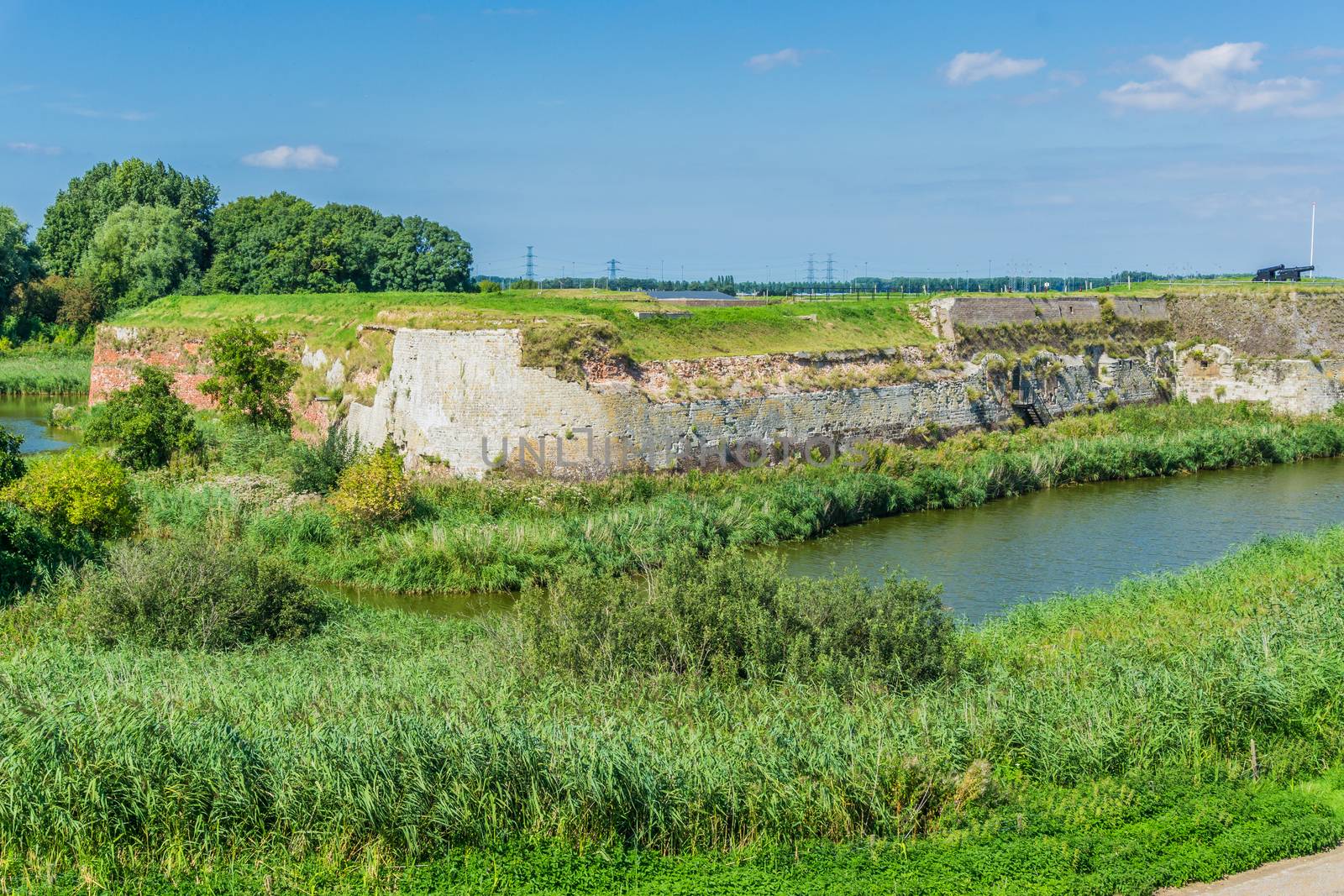 Old style stone wall in lake landscape