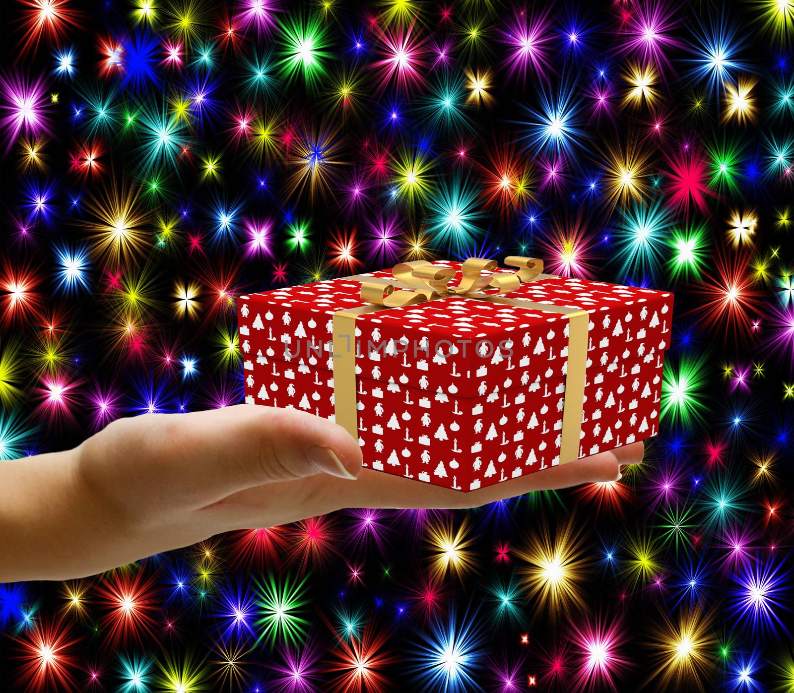 Christmas concept hand holding a wrapped christmas gift box and giving it away isolated on a christmas background with colorful stars