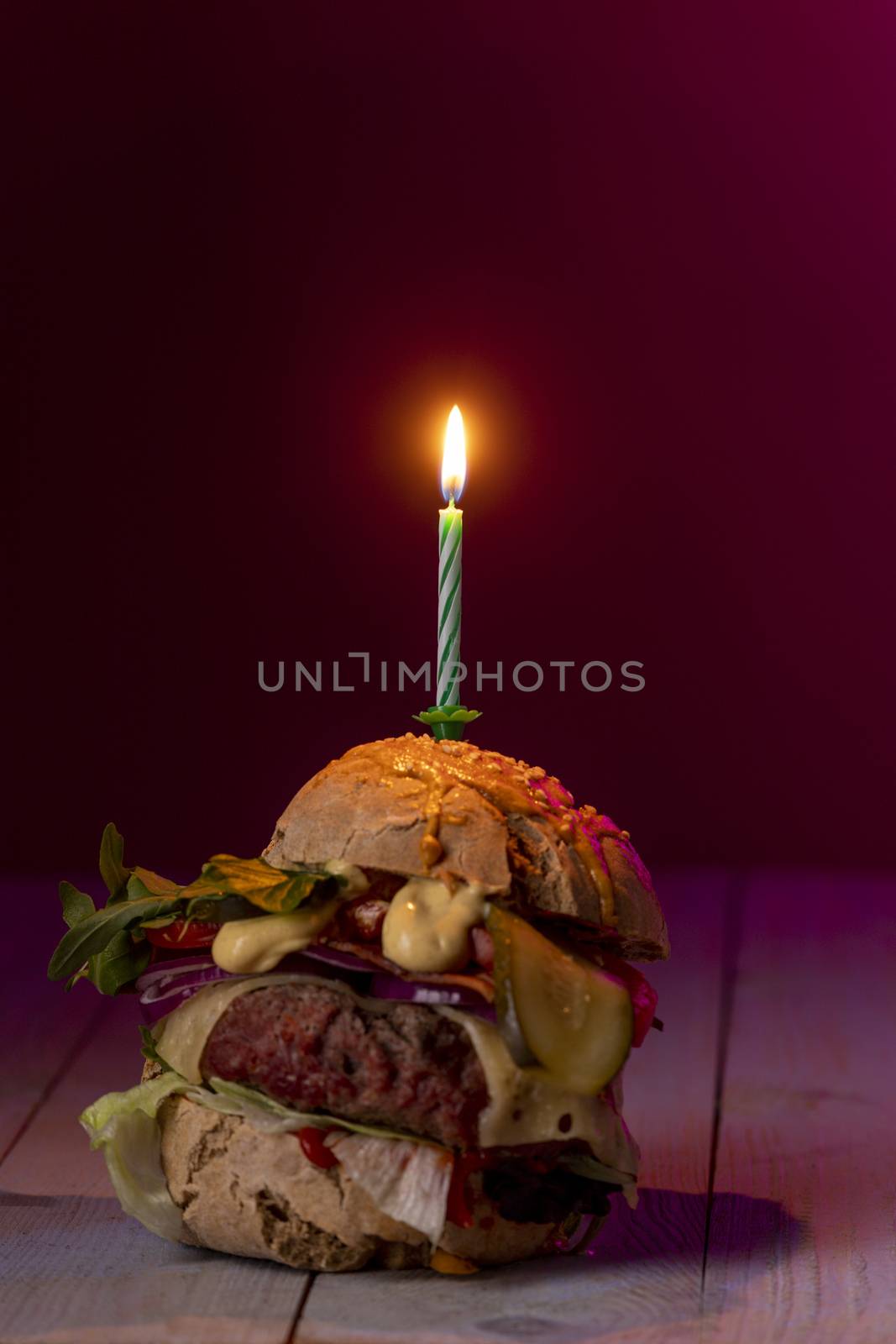 home made cheeseburger on dark wood