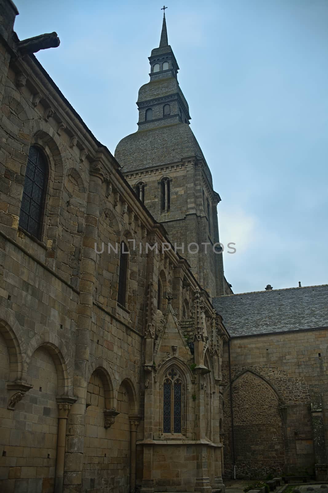 Huge old medieval stone catholic church in Dinan, France by sheriffkule