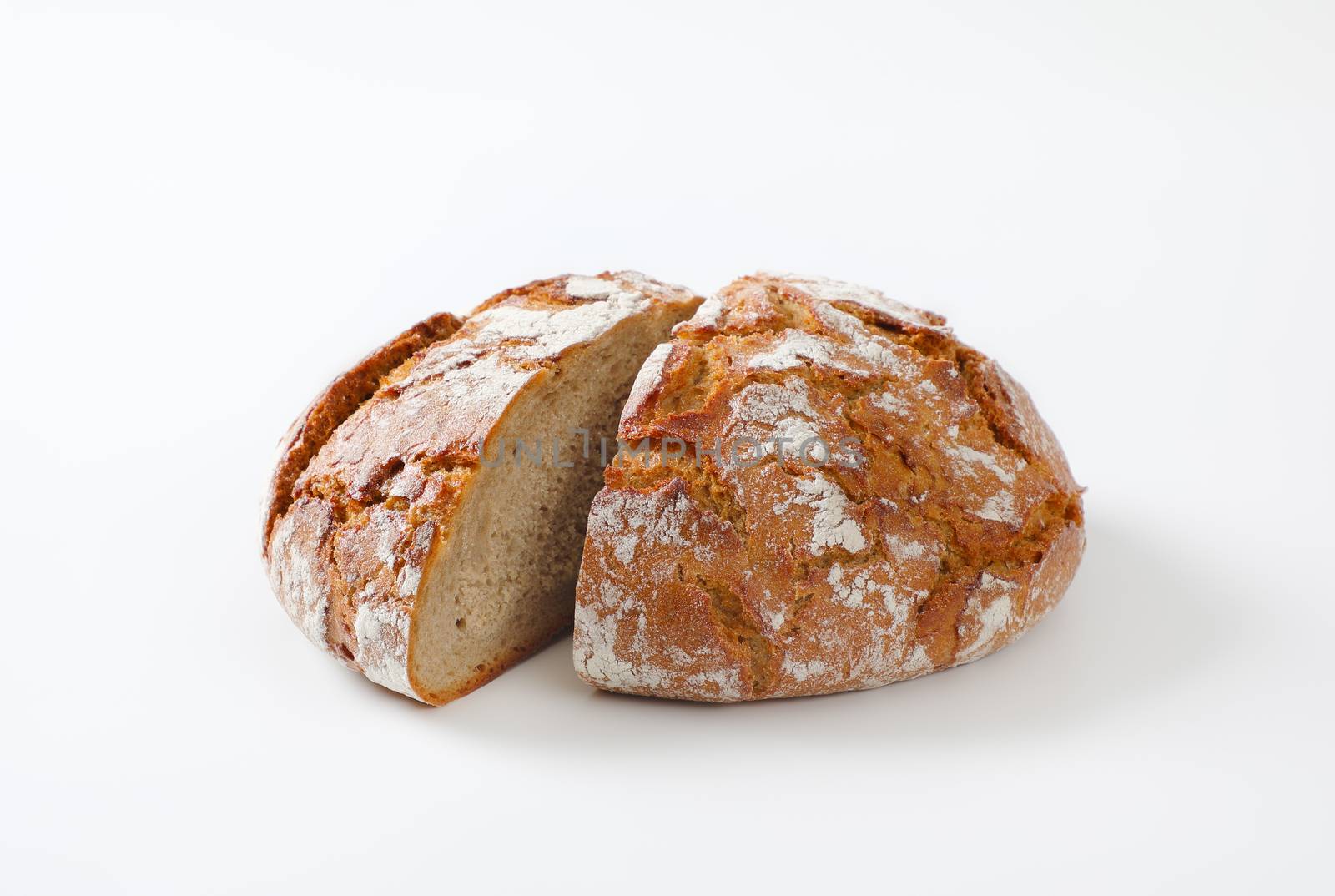 Rustic sourdough bread with crispy crust by Digifoodstock