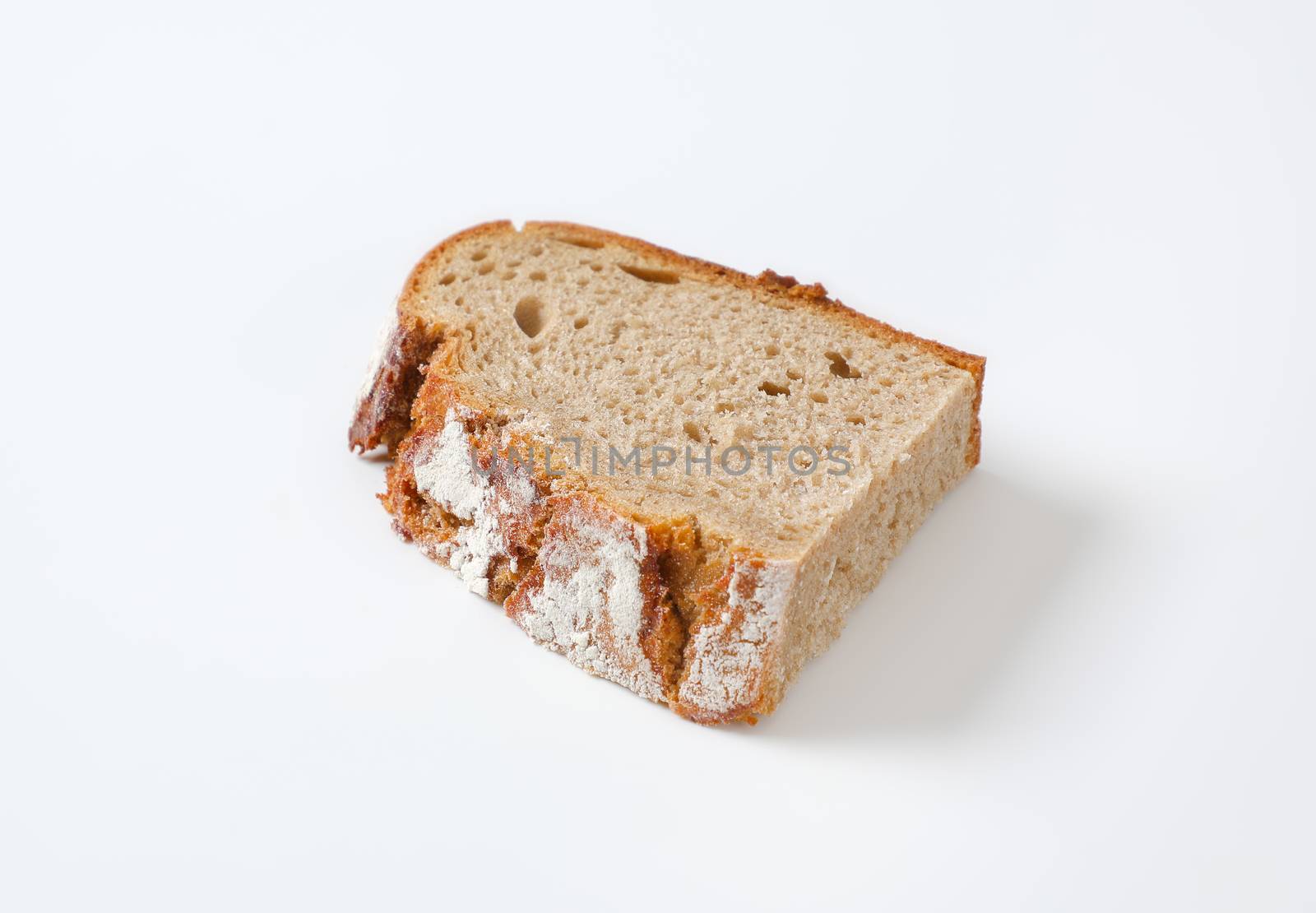 Half a slice of rustic sourdough bread with crispy crust