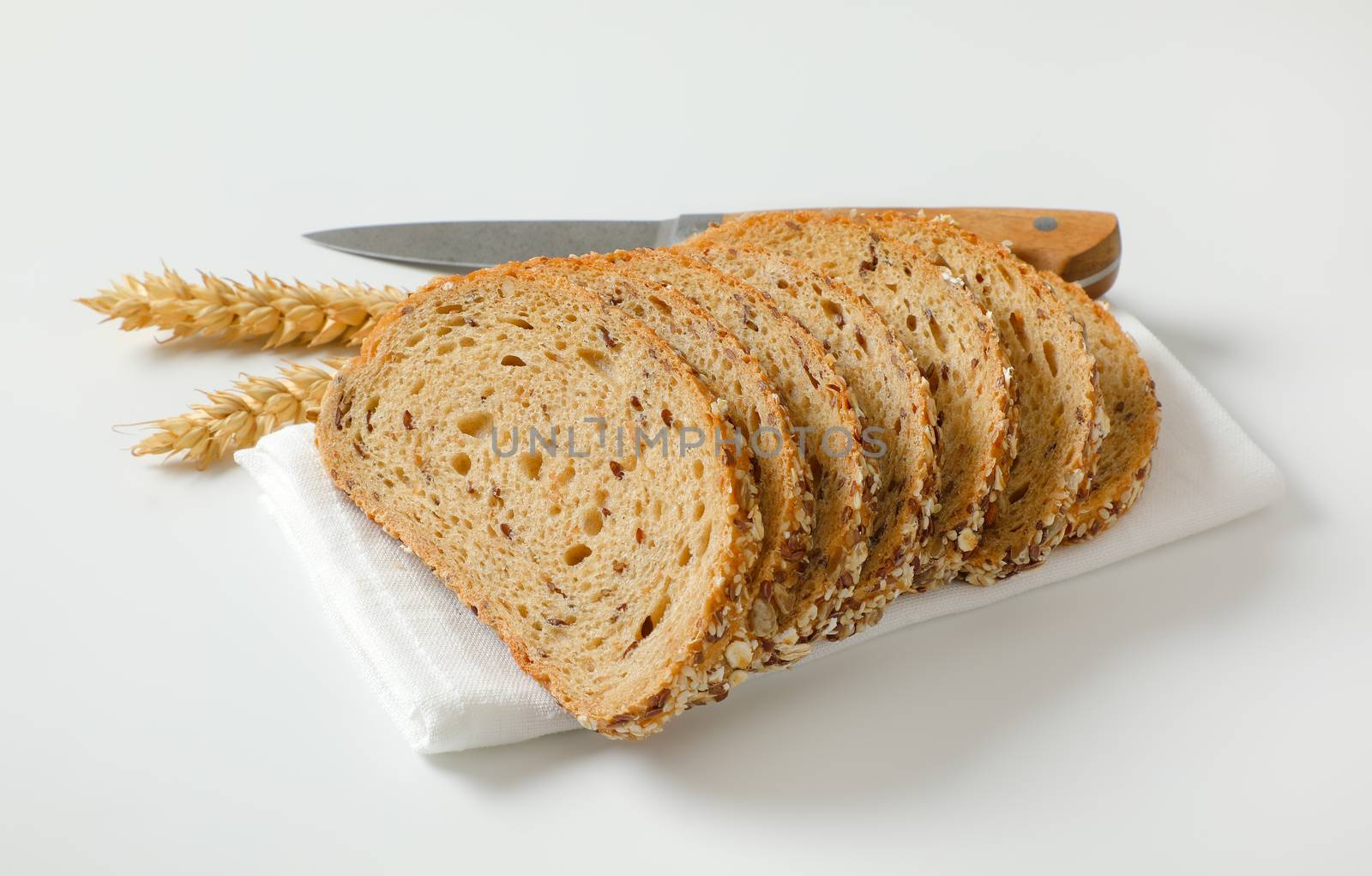 Sliced loaf of whole grain bread by Digifoodstock