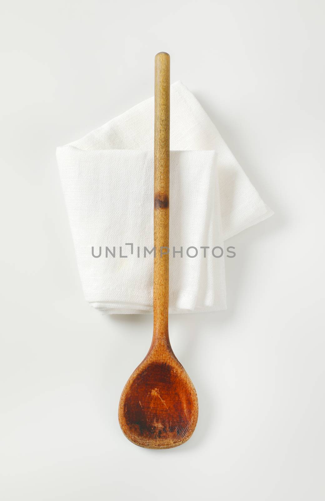 Old wooden stirring spoon by Digifoodstock