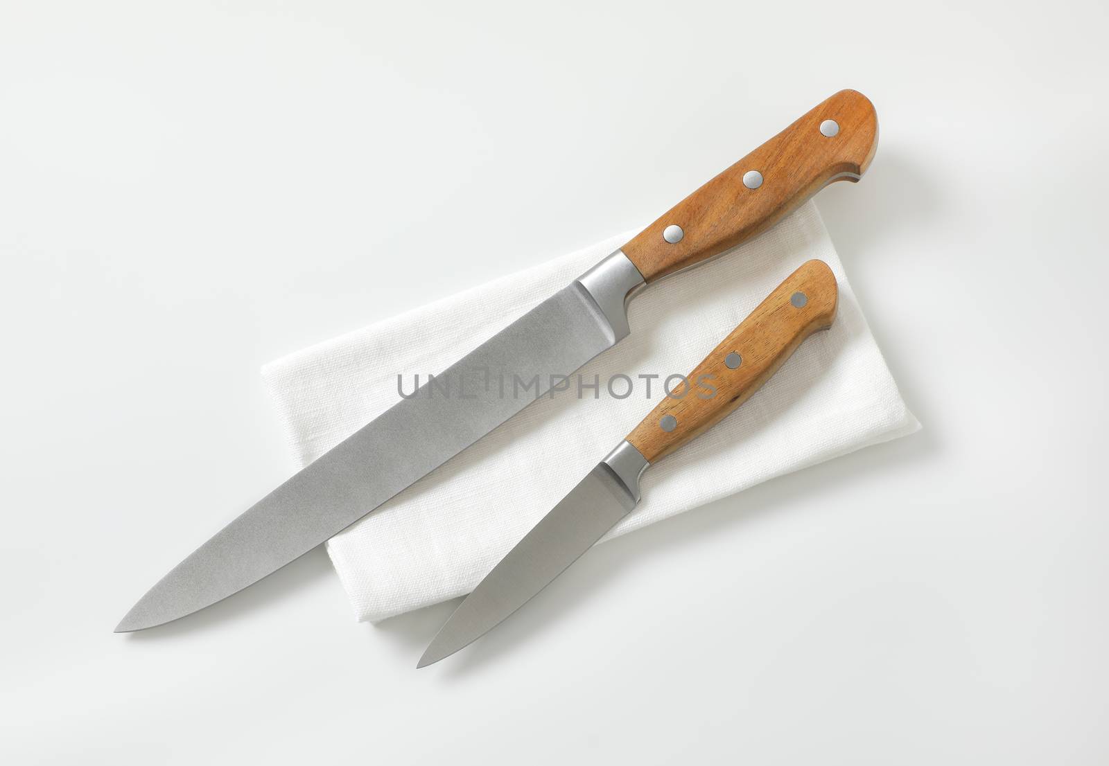 Kitchen utility knife and Paring knife on white napkin