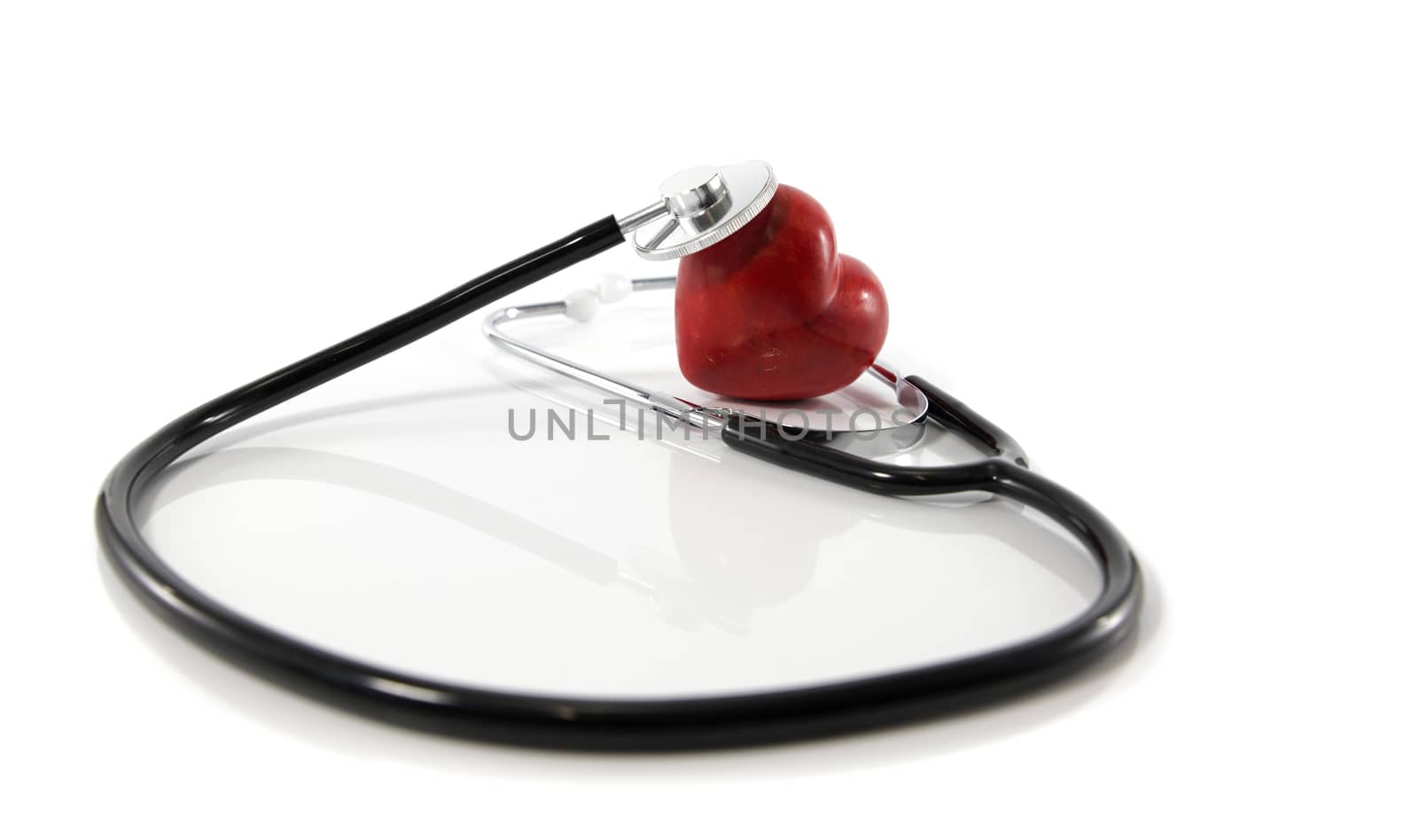 Heart and stethoscope isolated on white background  by compuinfoto