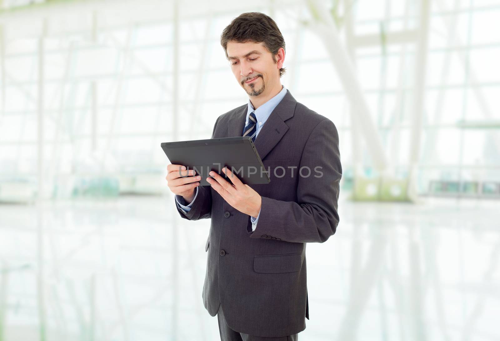 young businessman with a tablet pc, at the office