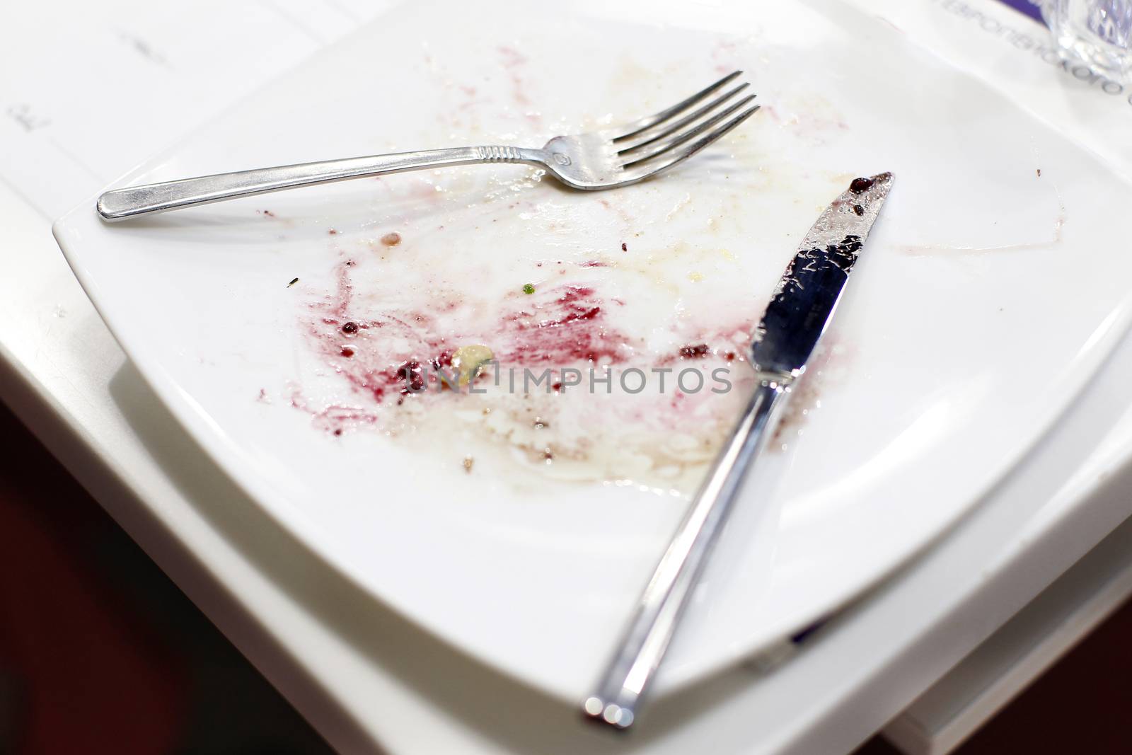 Empty dirty plate and cutlery, after eating.Plates after eating. Dirty dishes.