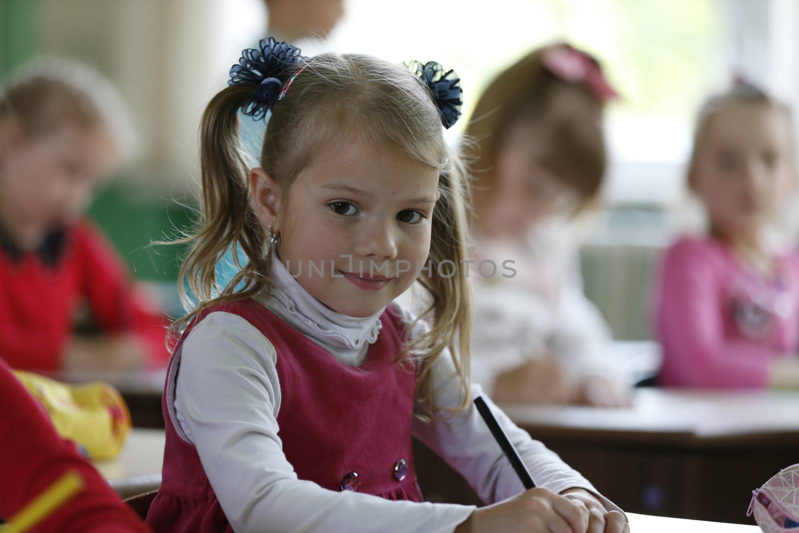 Child girl in kindergarten.Preschooler. Learn to write. Preparation for school. Preschool education