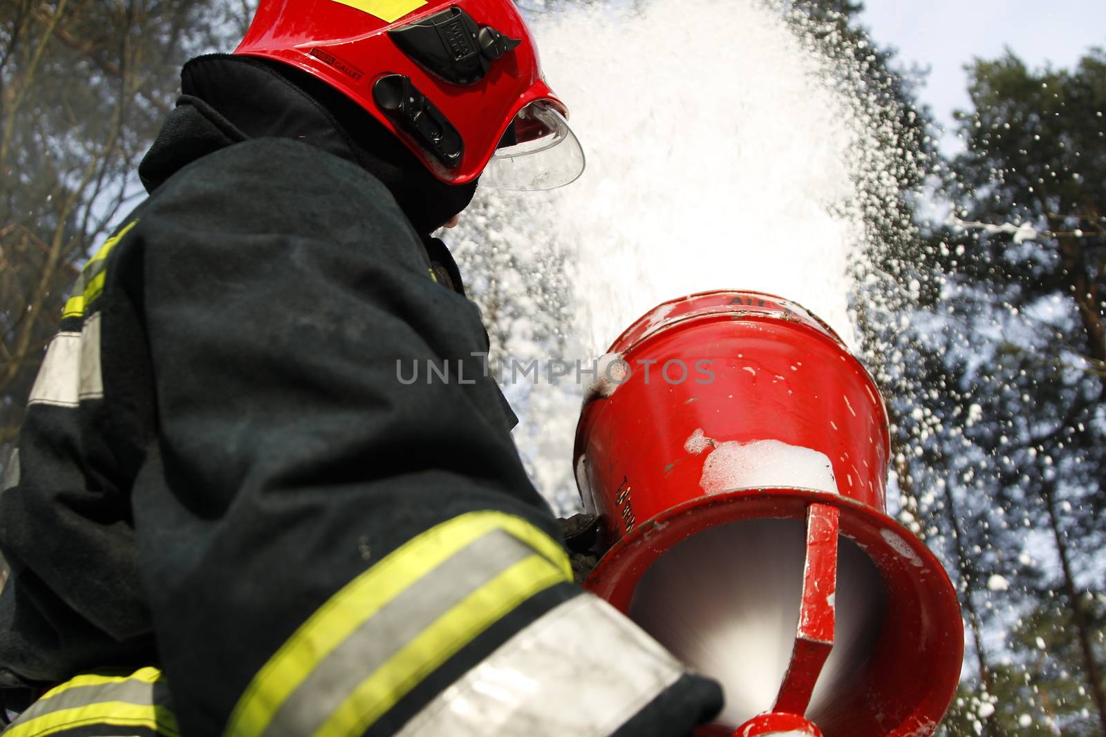 Firefighter extinguishes a fire.Fighting fire. Fire Foam