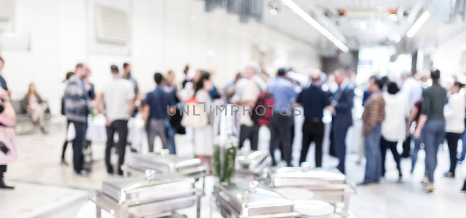 Blured image of businesspeople at coffee break at conference meeting. by kasto