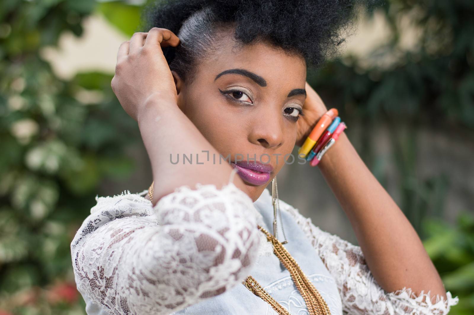 Closeup of pretty African woman posing outside