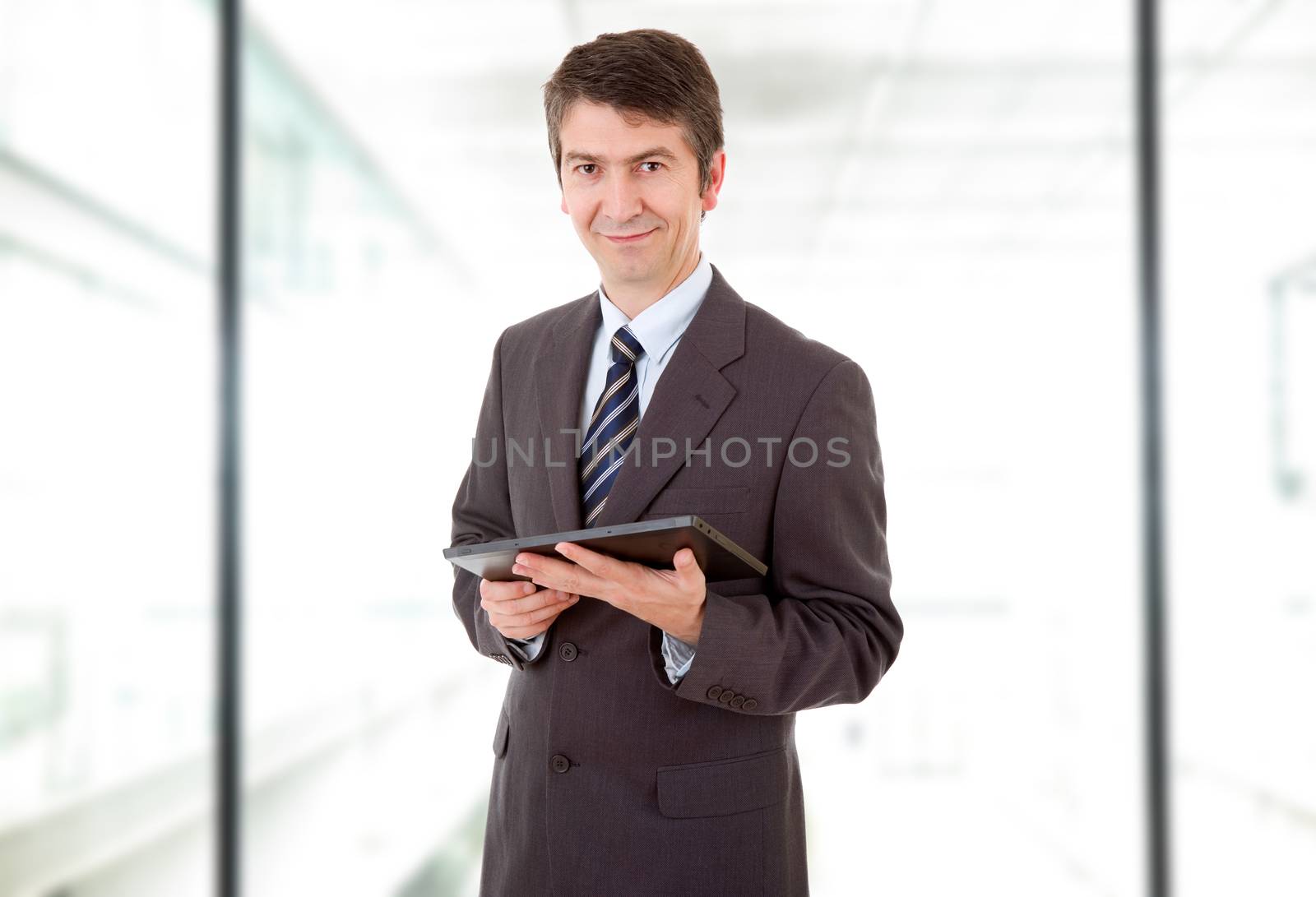 businessman using touch pad of tablet pc, at the office