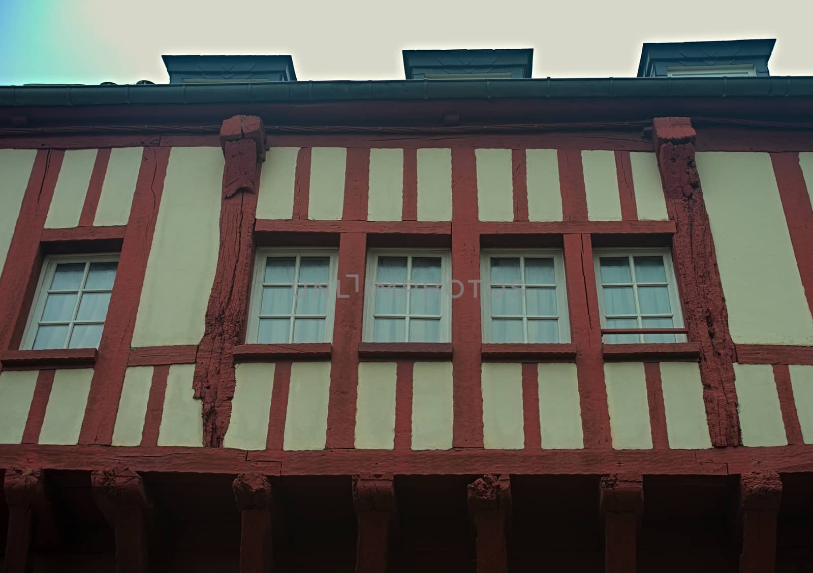 Windows and facade on medieval house in Dinon, France
