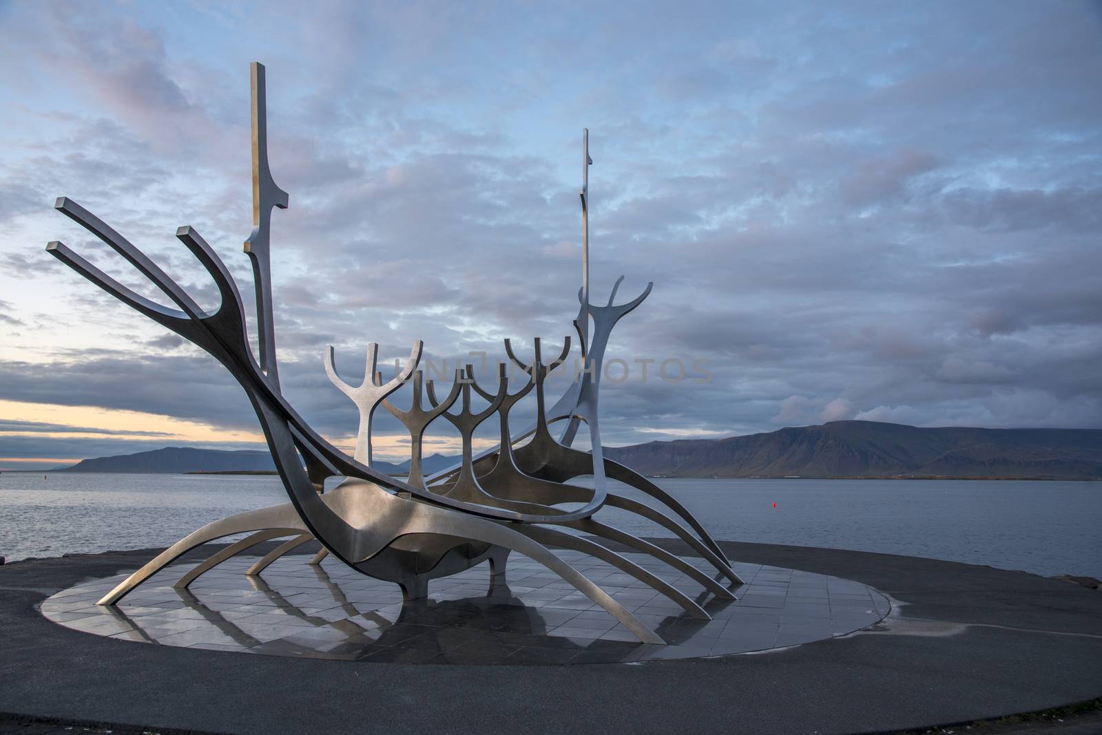 The Sun Voyager Monument on the waterfront in Reykjavik, Iceland. Cloudy weather.