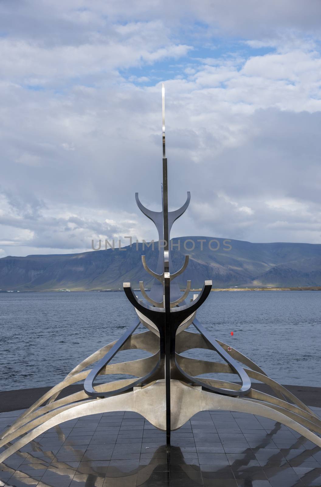 The Sun Voyager Monument on the waterfront in Reykjavik, Iceland. Cloudy weather.