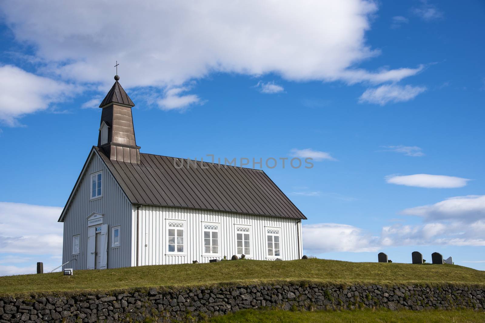 Strandarkirkja, Selvogur, Iceland. With White clouds and blue sky.