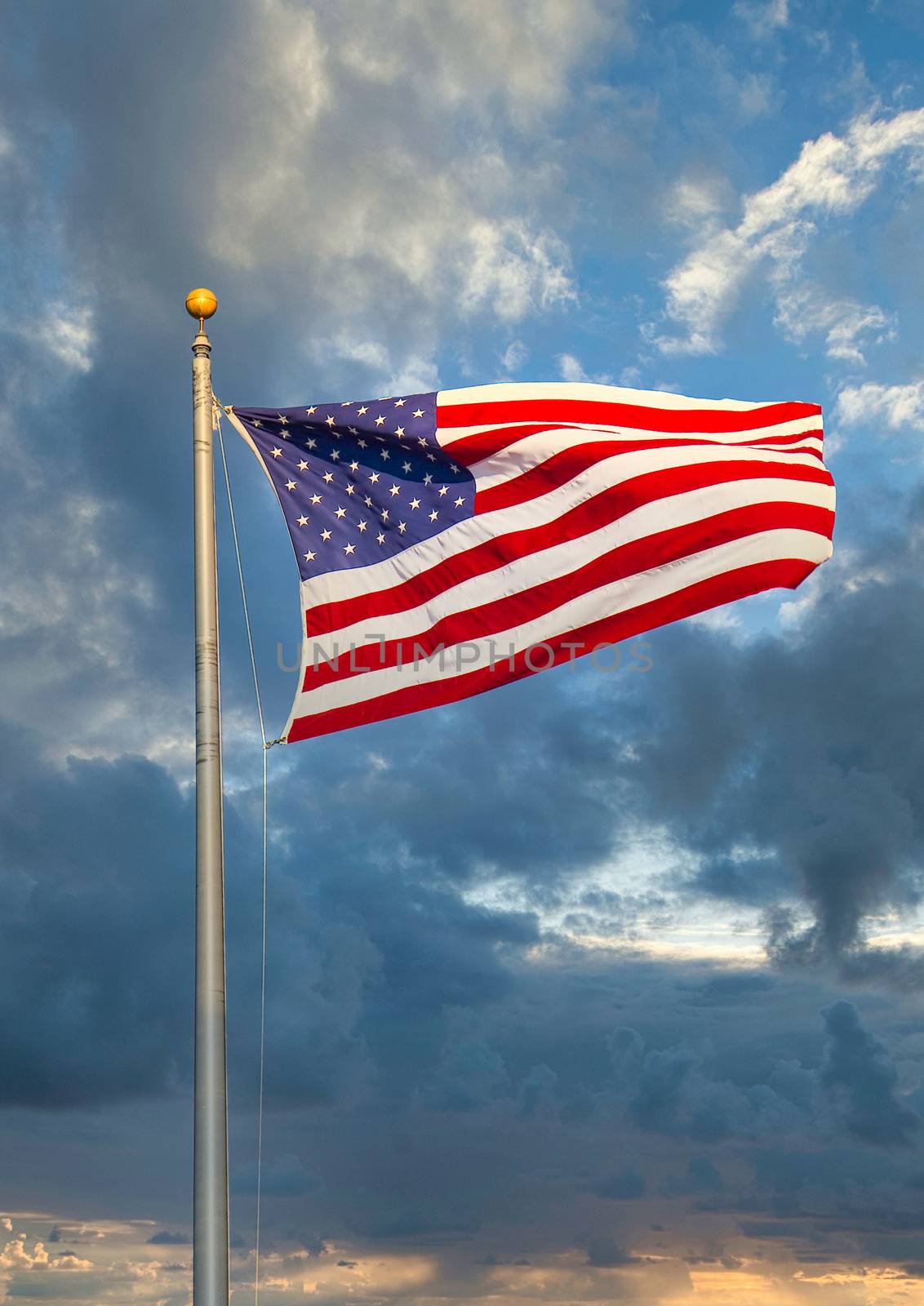 American Flag and Dramatic Sky by dbvirago