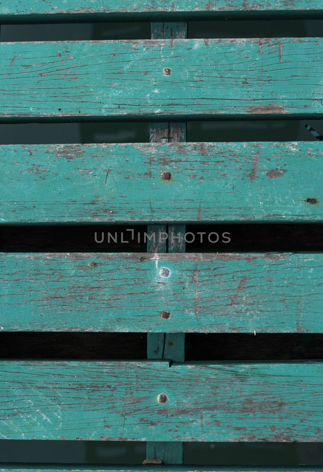 Green painted wooden fence, background texture