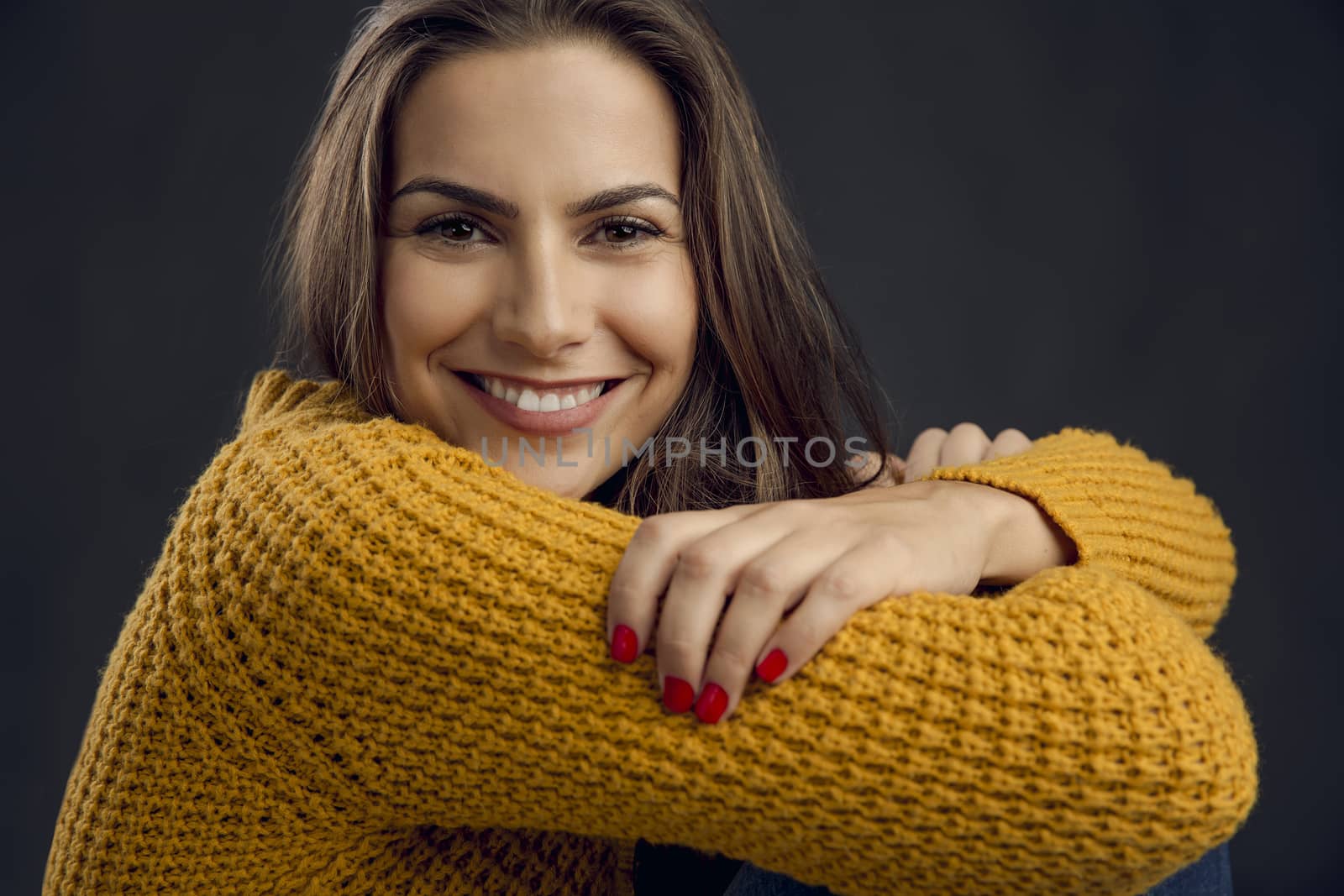 Shot of a beautiful young woman smiling to the camera and smiling