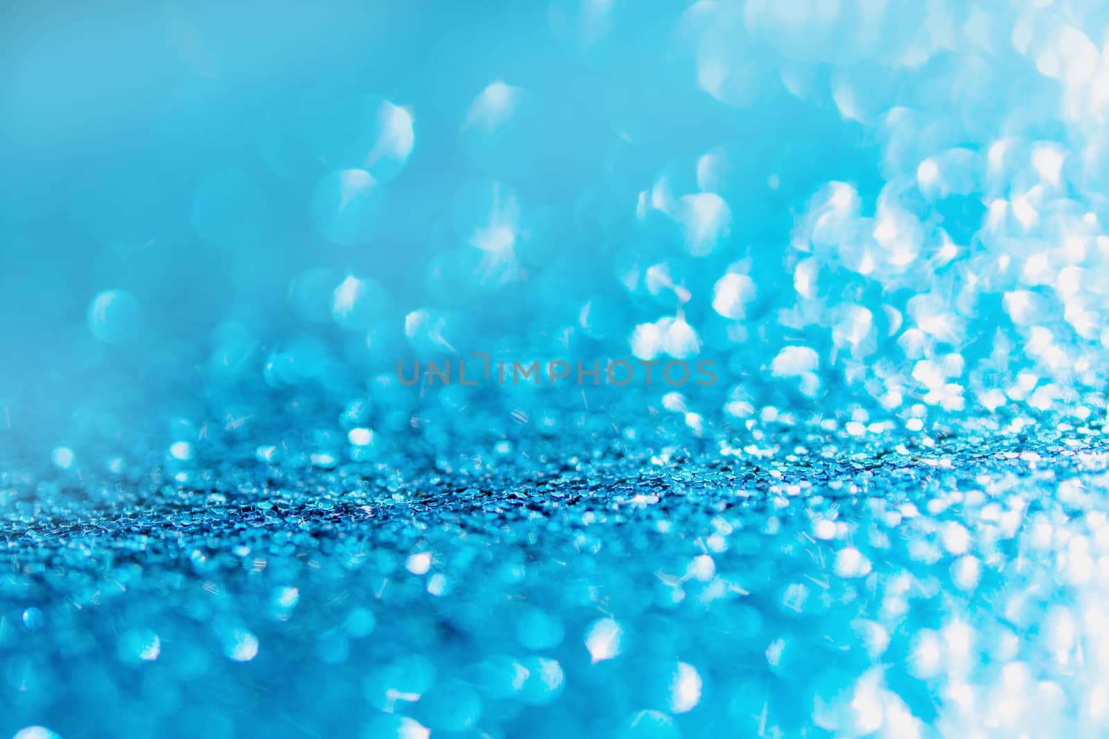 Defocused blue glitter background. blue abstract bokeh background. Christmas abstract background
