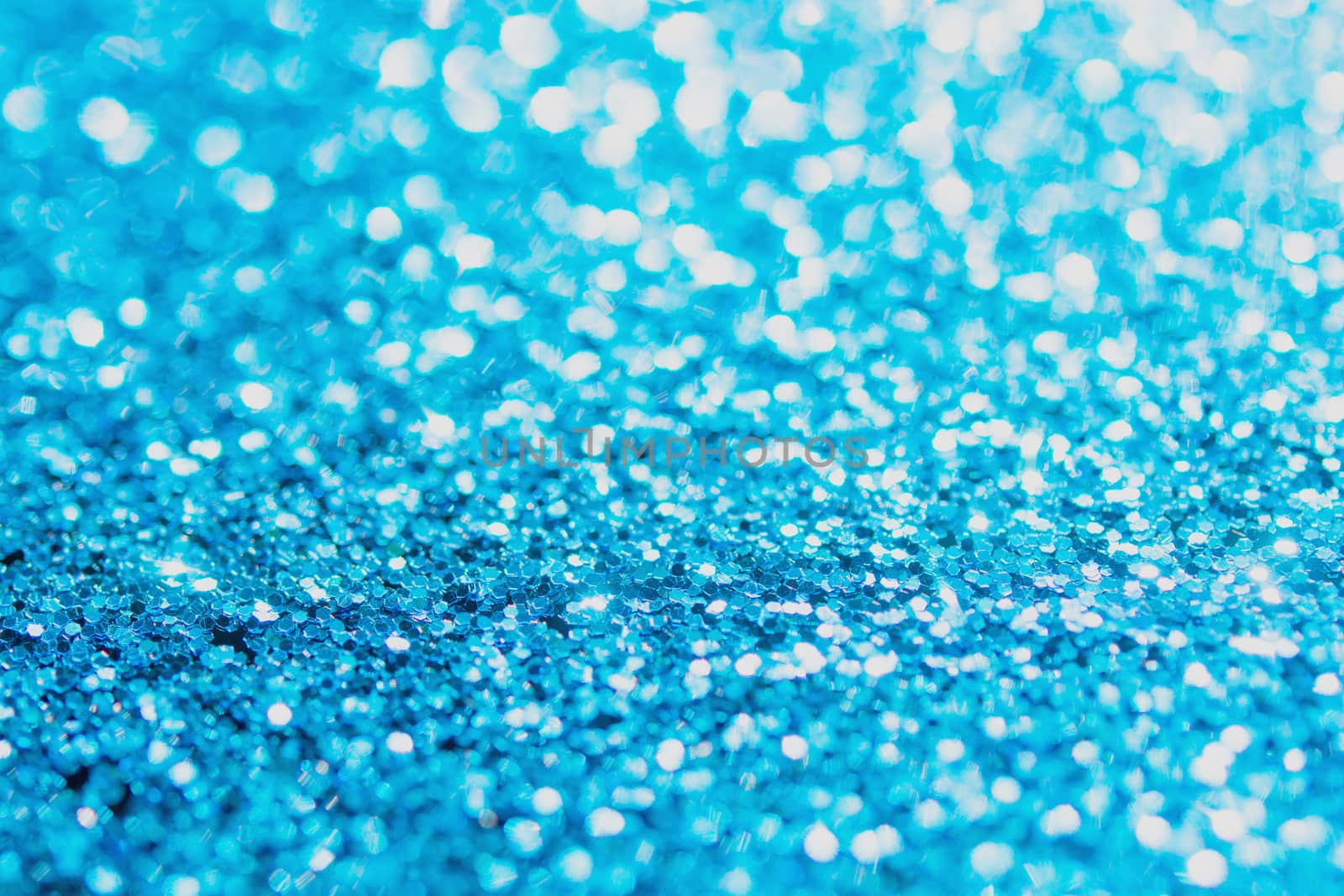 Defocused blue glitter background. blue abstract bokeh background. Christmas abstract background
