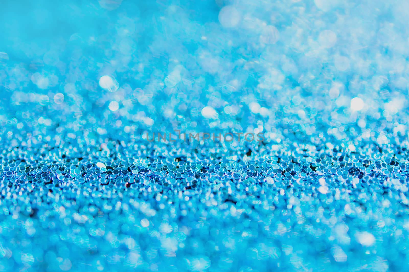 Defocused blue glitter background. blue abstract bokeh background. Christmas abstract background
