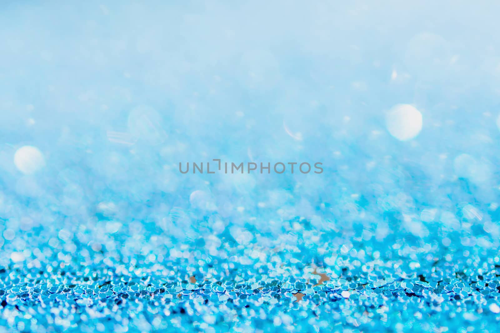 Defocused blue glitter background. blue abstract bokeh background. Christmas abstract background
