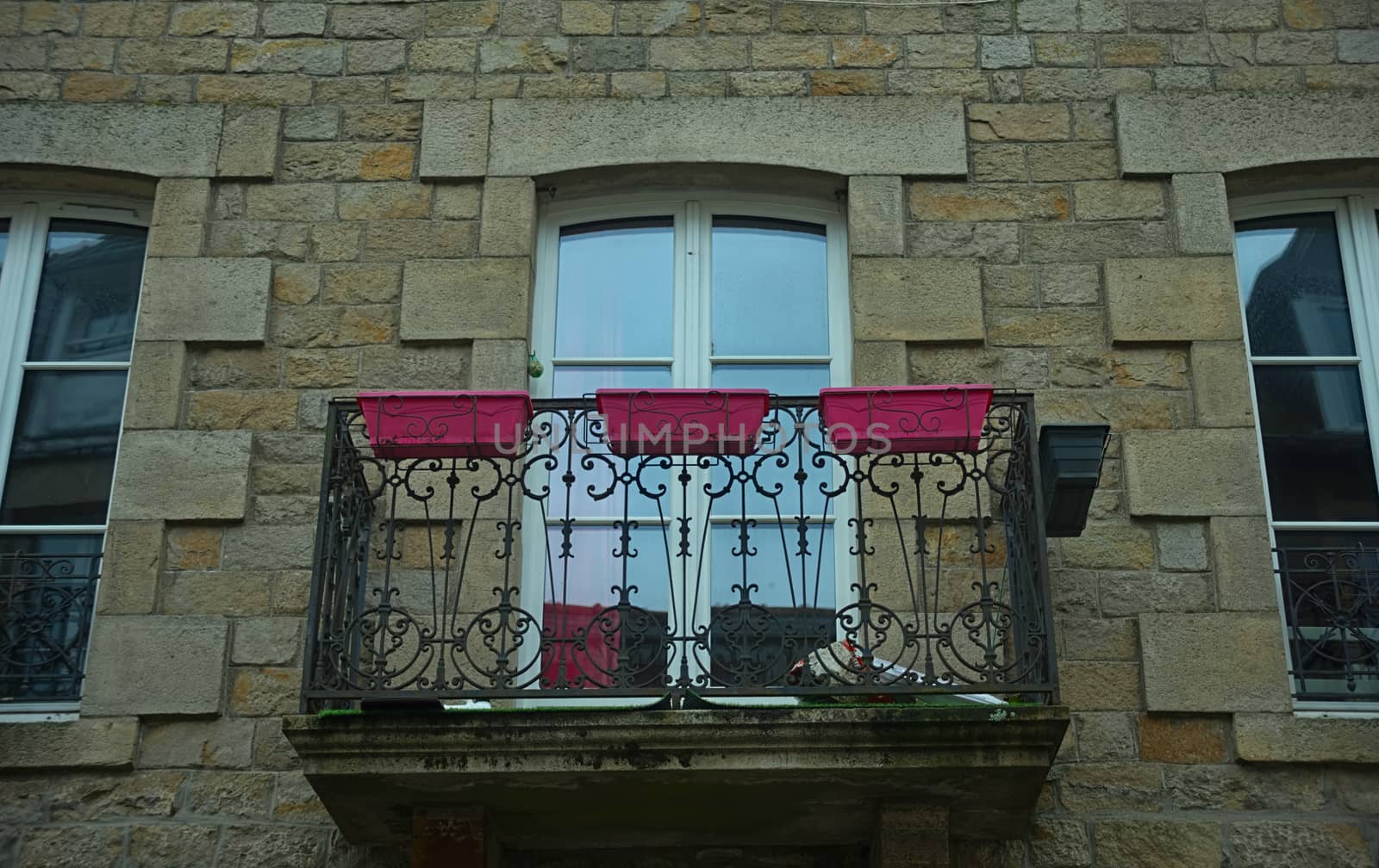 Small terrace with balcony door on old stone house by sheriffkule